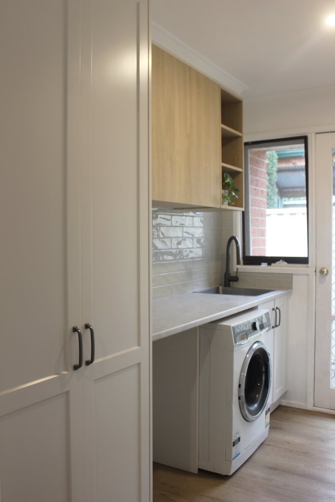 Timber laundry with green subway tiles, shaker style cabinetry, interior design melbourne